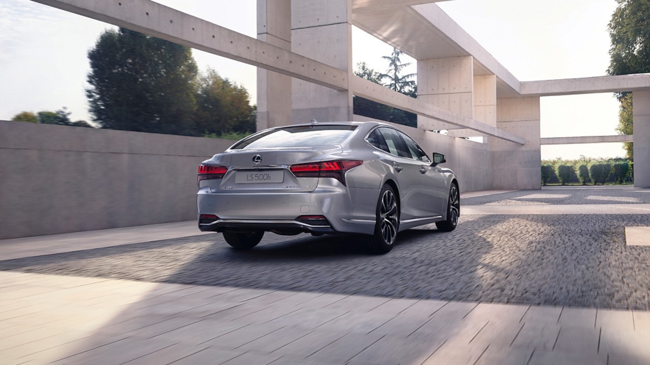 Rear view of a Lexus LS driving 