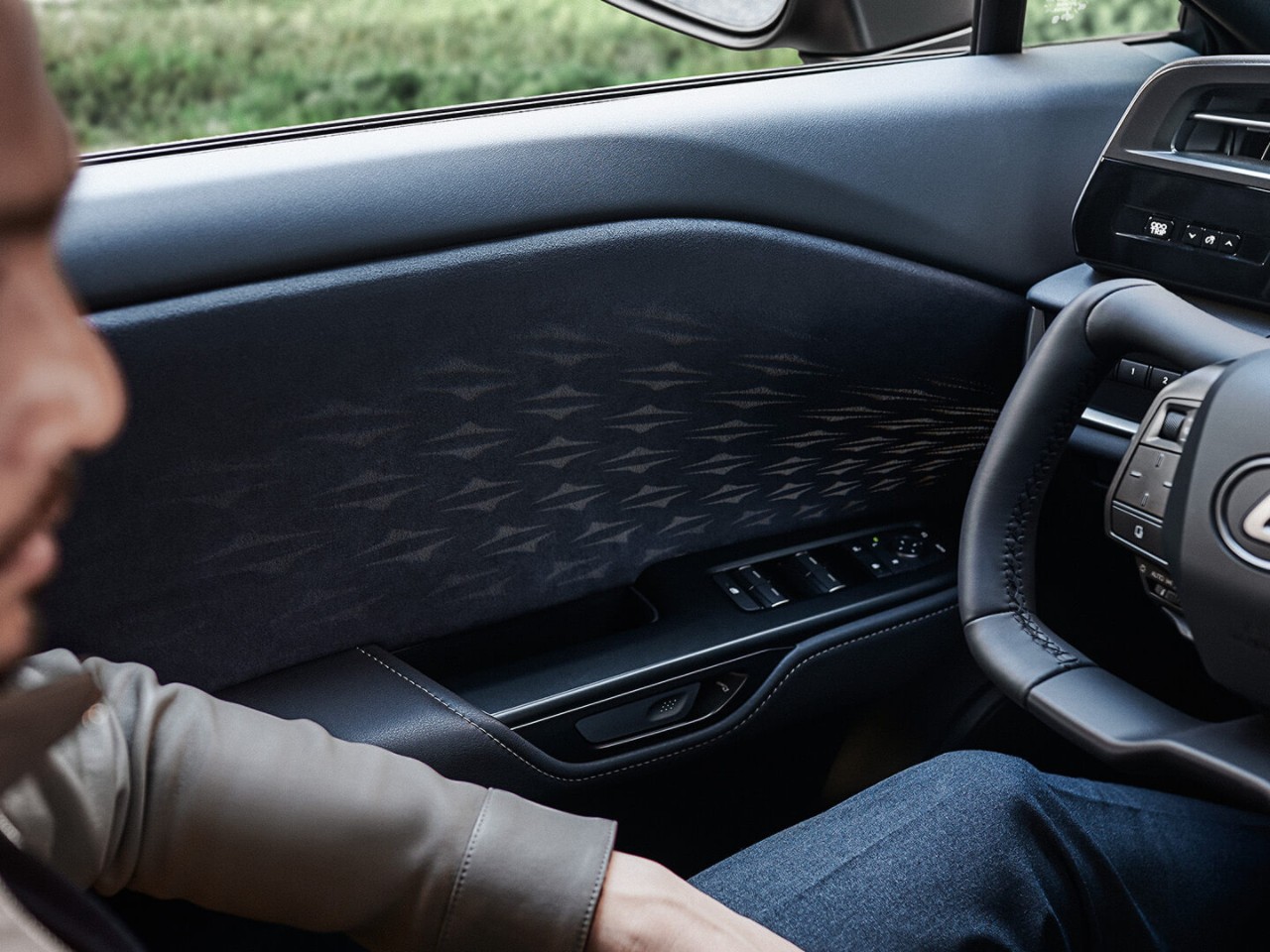 The Lexus RZ's drivers door interior