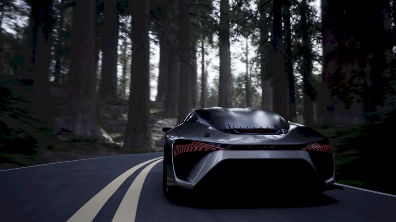 Rear view of the Lexus Electrified Sport Concept driving through a wooded area