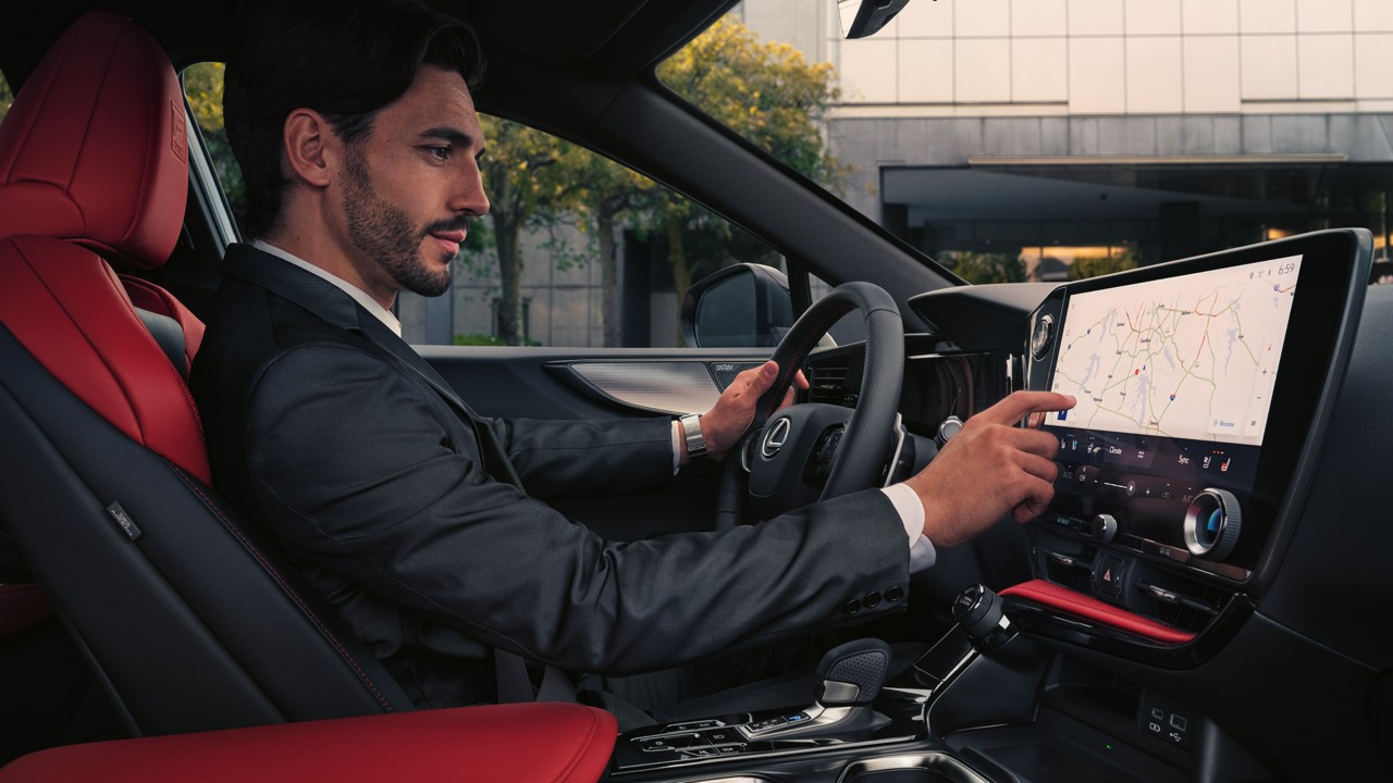 A man sat in a Lexus NX